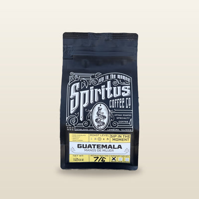 Guatemala Manos de Mujer 12 oz bag, roasted on date written by hand, studio photo