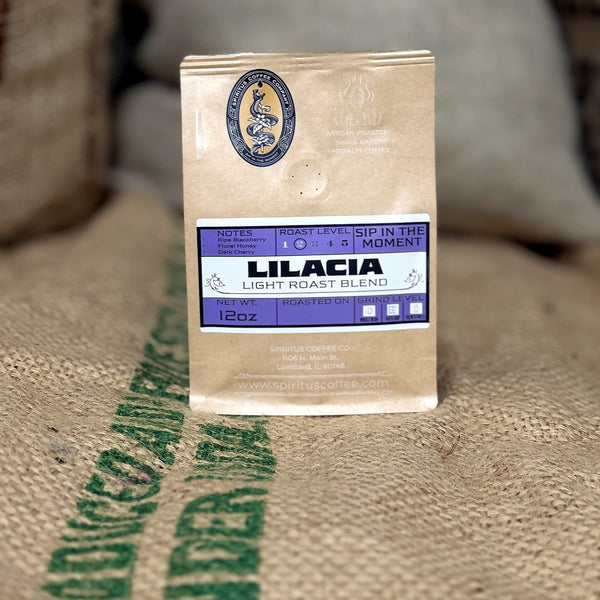 Lilacia Light Roast bag standing on a burlap coffee sack at the Spiritus roastery
